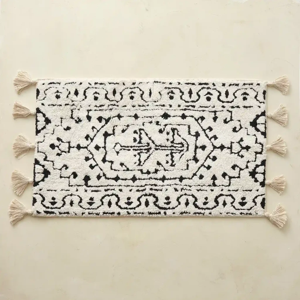Arden Noir plush bathroom rug with tassel details
