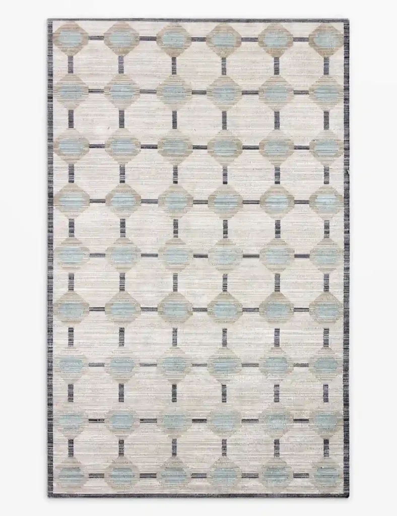 Muted geometric patio rug