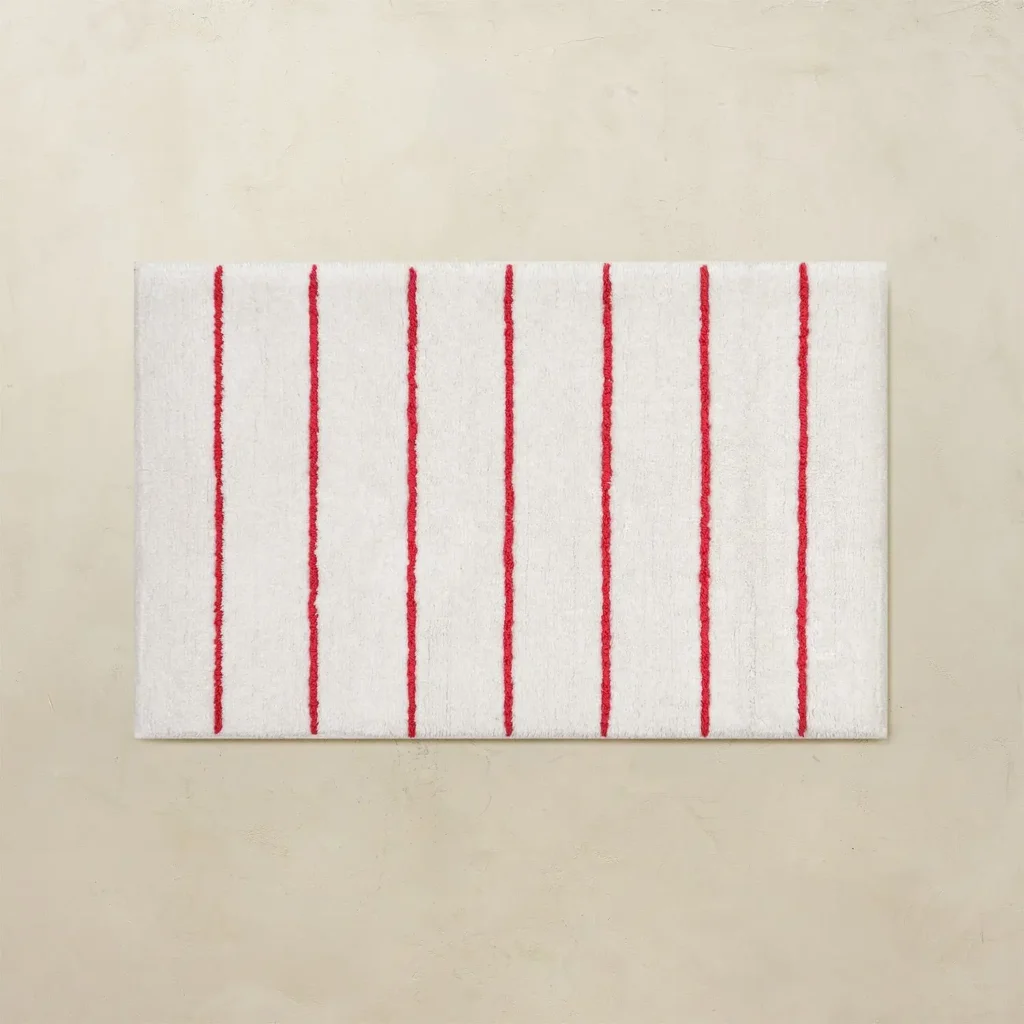 Red striped bathroom rug with white base