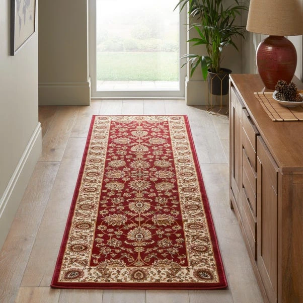 Warm-toned plush traditional runner with border