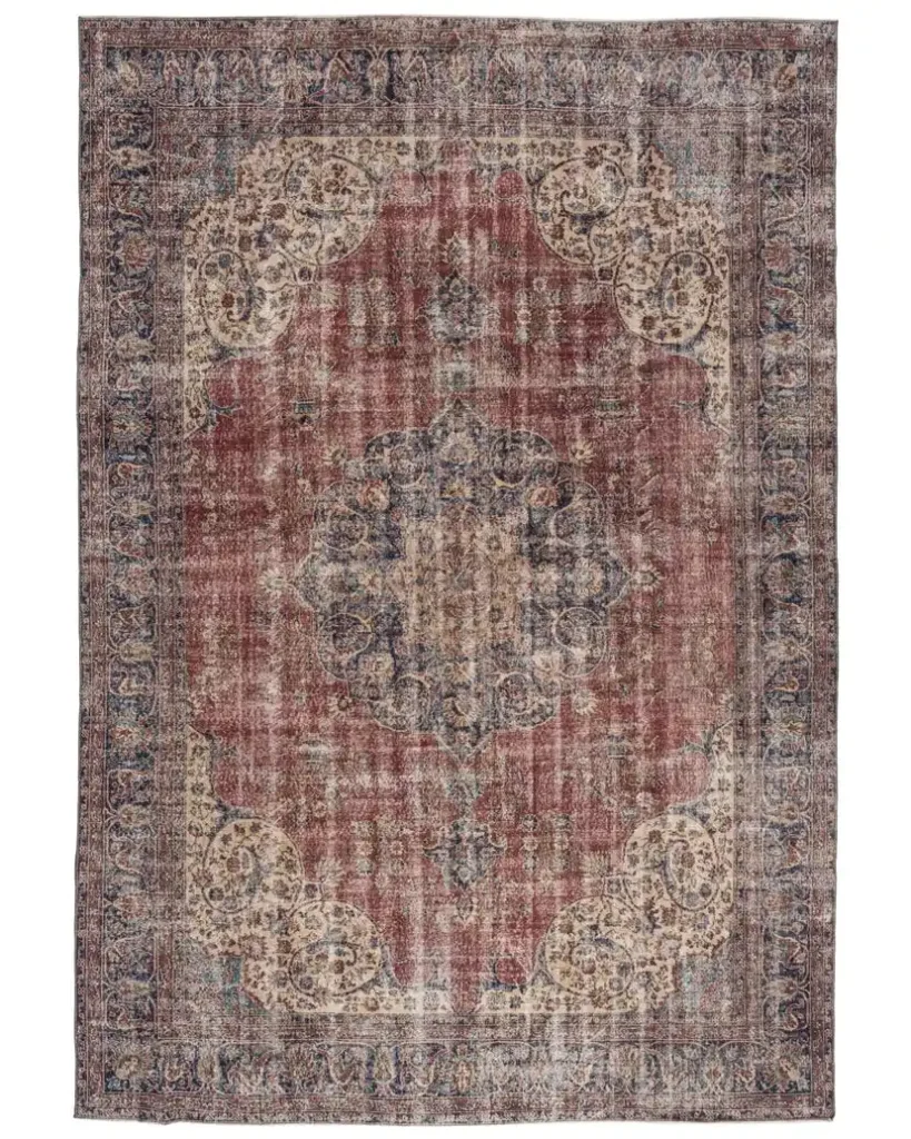 Close-up of Aena vintage rug showing hand-knotted wool texture and floral pattern