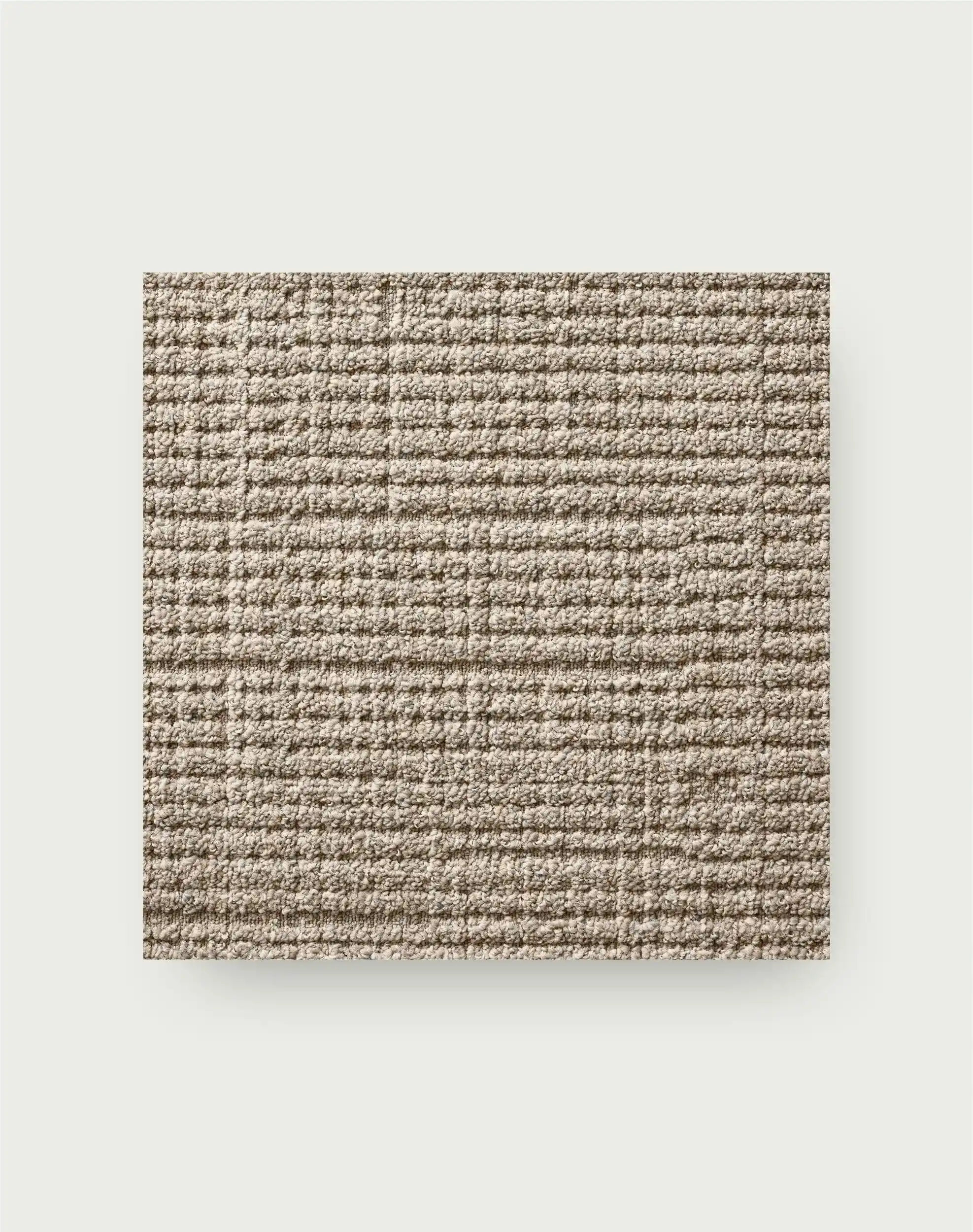 Jute-inspired carpet tiles in dining room with wooden slat wall