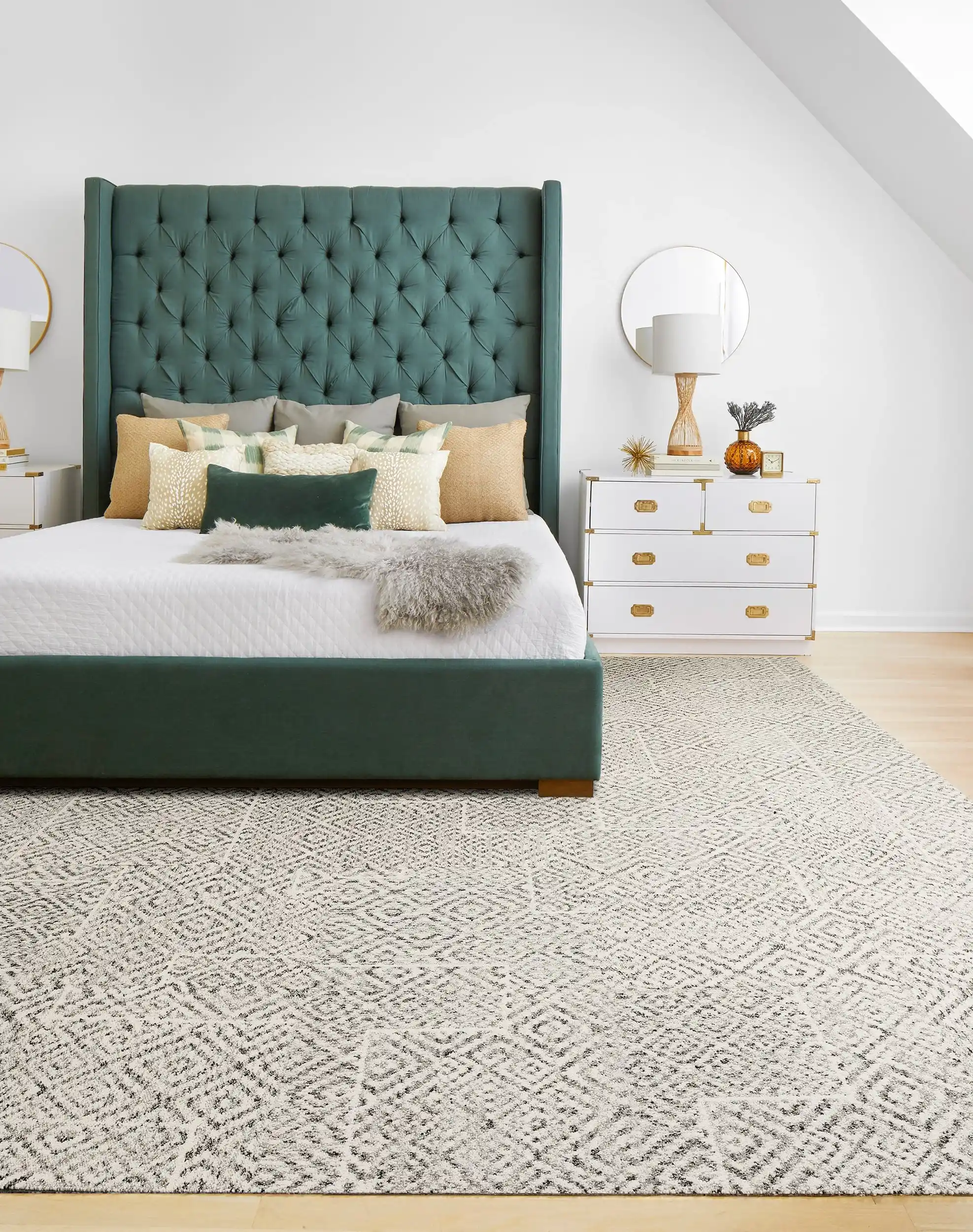 Light gray woven carpet in a bedroom with a green headboard